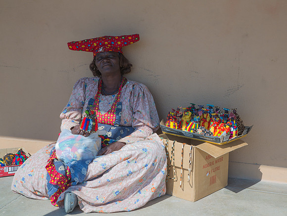 Woman Selling Dolls