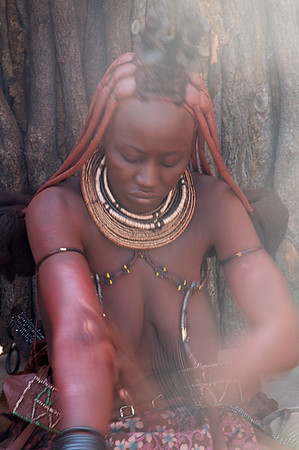 Himba Woman Applying Body Paint