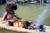 Menjamai Woman and Child Cooking Fish on Karawari River