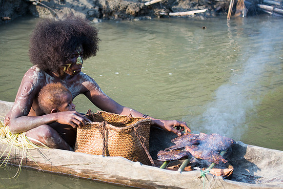 Menjamai Woman and Child Cooking Fish on Karawari River