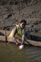 Menjamai Woman Cleaning Fish on Karawari River
