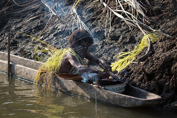 Menjamai Woman Cooking Fish on Karawari River