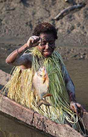 Menjamai Woman with Fish on Karawari River